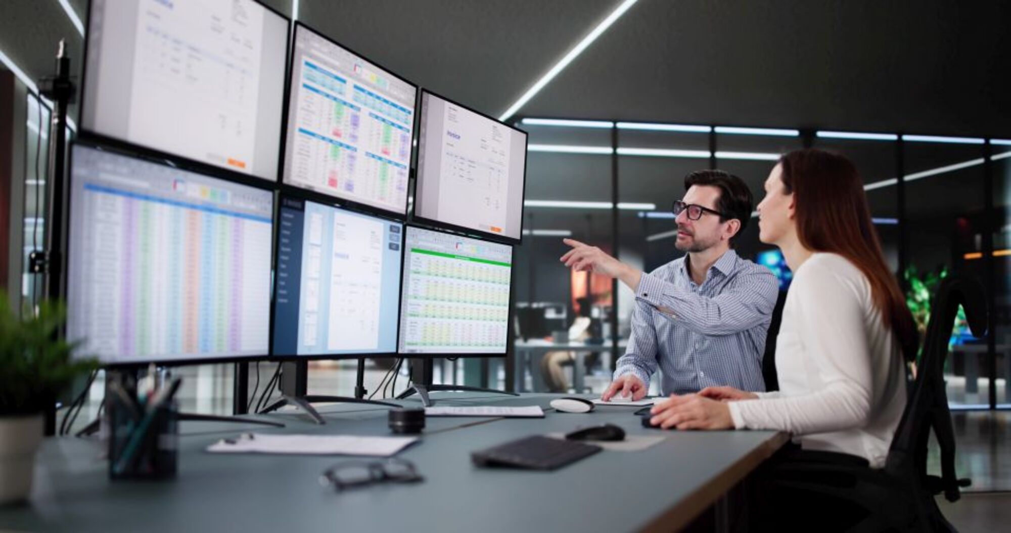 Corporate Accountant Analyzing Tax Invoices on Desktop Computer Screen